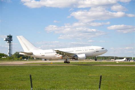 Airplane landing on runway stock photo. Image of aircraft - 30495322