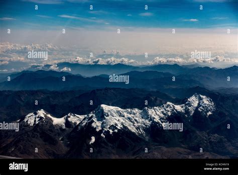 An aerial view of the snow capped Peruvian Andes, shot from an airplane ...