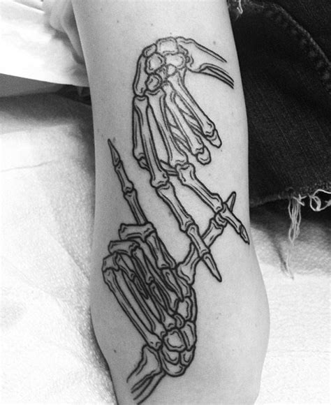 Carah Faye Charnow's Skeleton Hand "LA" Arm Tattoo | Steal Her Style