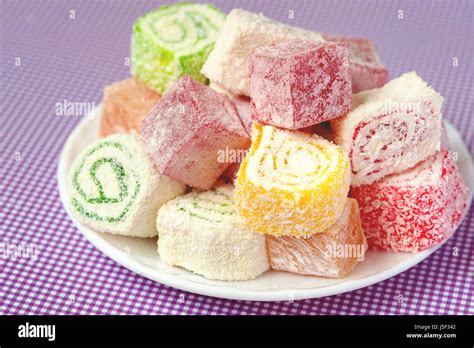 Set of assorted traditional eastern desserts. Arabian sweets on a metal dish. rahat lokum in a ...