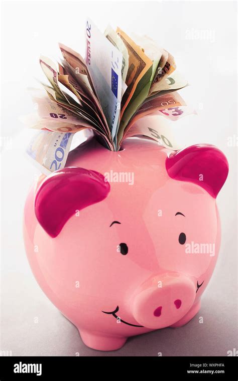 Full Piggy Bank Stock Photo - Alamy