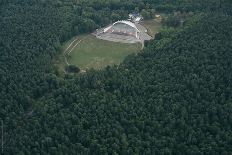 "Aerial View Of Stadium In The Forest." by Stocksy Contributor "Luis Velasco" - Stocksy