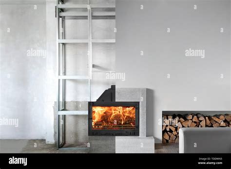 Installation of wood fireplace insert in livingroom Stock Photo - Alamy