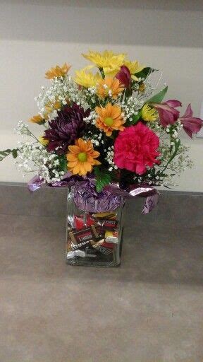 Hy-Vee Signature Sweetness Bouquet with a twist #candyarrangment #candyandflowers | Glass vase ...