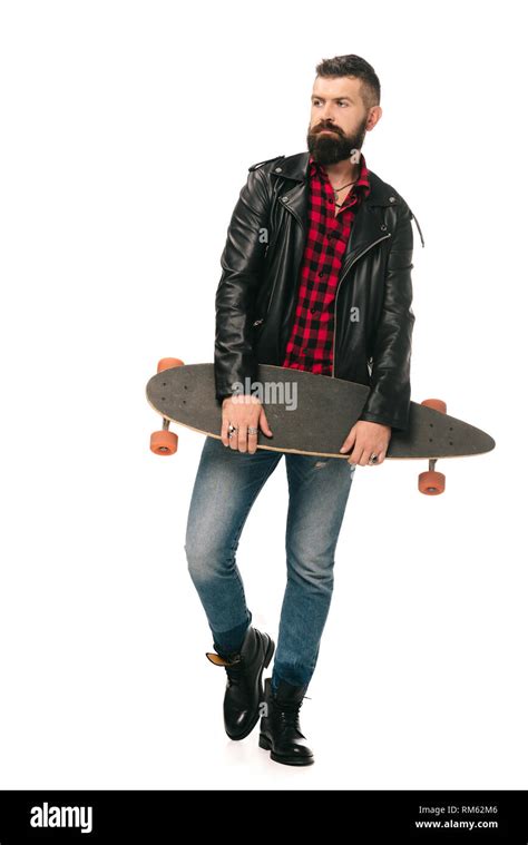 skateboarder in black leather jacket posing with longboard isolated on ...