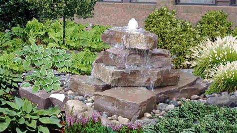 Build a stacked stone water feature: easy steps | Stone water features, Pondless water features ...