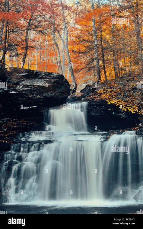 Autumn waterfalls in park with colorful foliage Stock Photo - Alamy