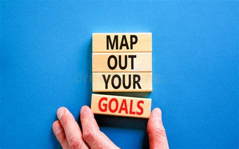 Support and Map Out Your Goals Symbol. Concept Words Map Out Your Goals on Wooden Blocks on ...