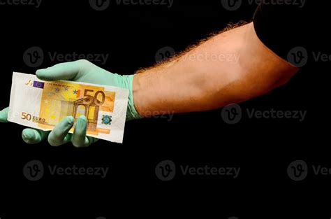 Hand holding cash on black background 17476496 Stock Photo at Vecteezy