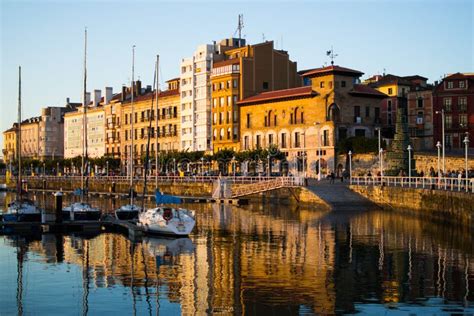 Gijon, Asturias, Spain; 09/26/2018: Sunset in the Dock of Gijon, Asturias, Spain, with the ...