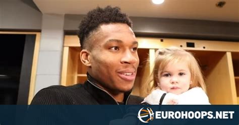 Giannis Antetokounmpo answers questions while holding a baby - Eurohoops