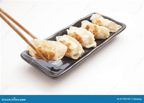 Japanese Dumplings with Chopsticks Stock Image - Image of cook, cooked ...