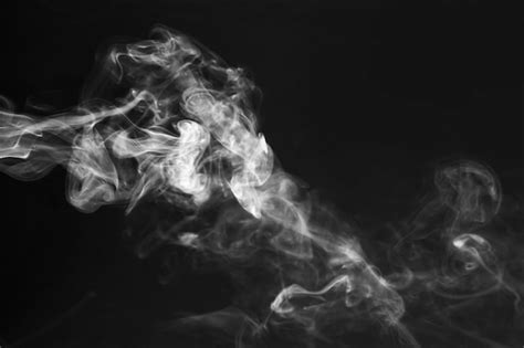 Premium Photo | White smoke effect on the black background