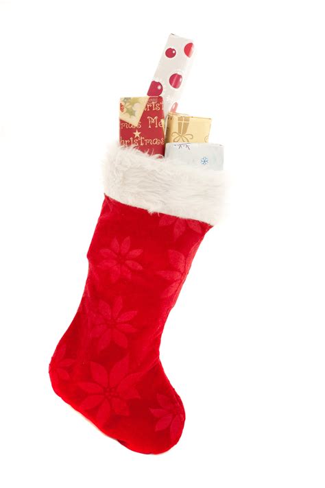 Photo of Isolated red Christmas stocking with gifts | Free christmas images