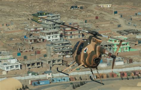 An MD 530 flies over Kabul, Afghanistan. The MD 530 is a new aerial ...