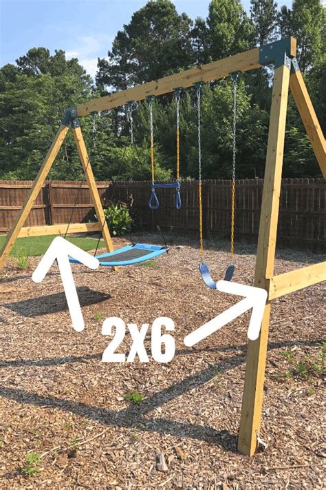 a wooden swing set with two swings in the middle and an arrow pointing to 2x6