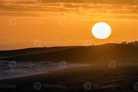 red sunrise in patagonia beach 12008920 Stock Photo at Vecteezy