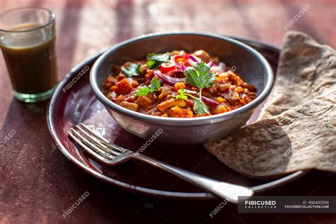 Indian chicken curry with chapati — chai tea, chappathi - Stock Photo | #488400098