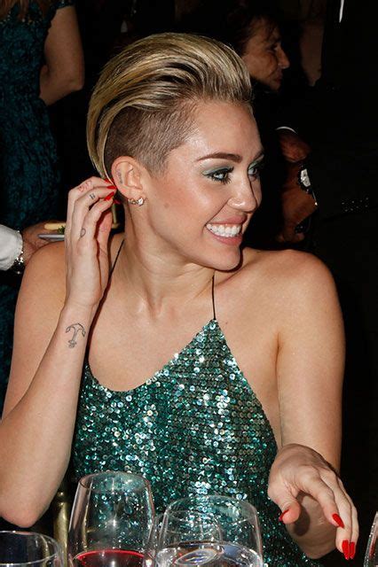 15 Best Miley Cyrus Tattoo Designs, Meanings, and Photos