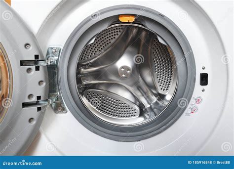 internal view of an empty washing machine drum during wash - MistyFelicja