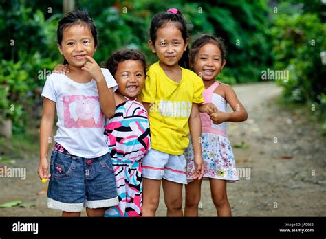 Four little girls in desert village. Palawan, Philippines, Asia 3, 4, 5, 6, 7, years, years old ...