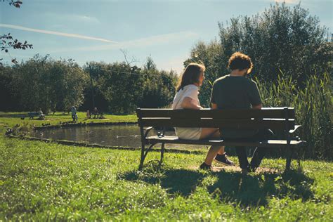 Two Girl and Boy Sitting on Bench Outdoor · Free Stock Photo