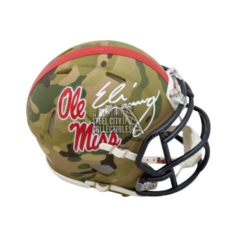 Eli Manning Autographed Ole Miss Camo Mini Football Helmet - Fanatics ...