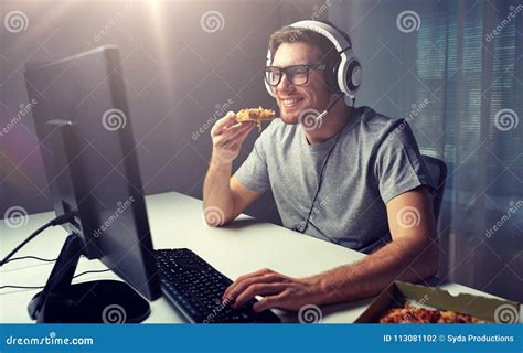 Man in Headset Playing Computer Video Game at Home Stock Photo - Image ...