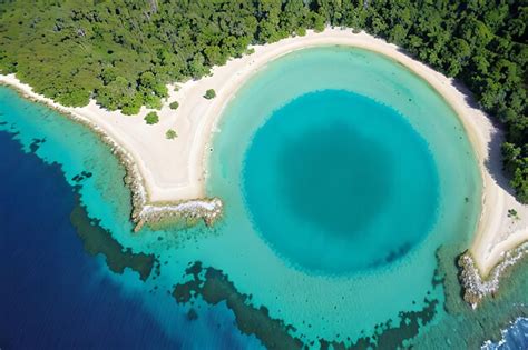 Premium AI Image | Aerial shot of the Blue Hole a natural phenomena and ...