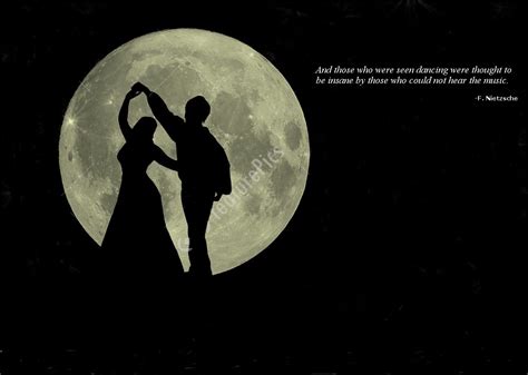 Silhouette of two people dancing in the moonlight