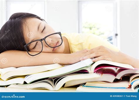 Tired Student Girl With Glasses Sleeping On The Books Stock Photo - Image: 43938261