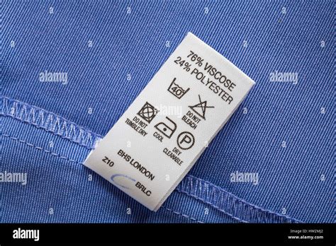 care instructions, washing instructions, label in woman's blue jacket Stock Photo: 135899066 - Alamy