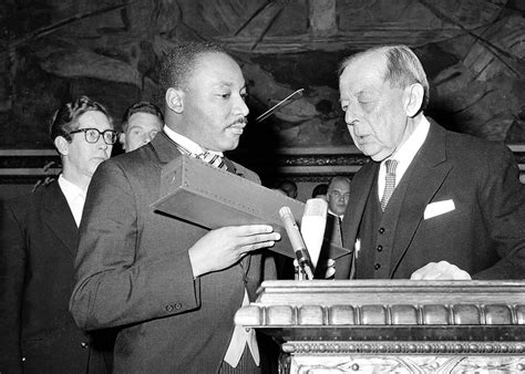 Dr. Martin Luther King Jr. receives the Nobel Peace Prize from the hands of Gunnar Jahn ...