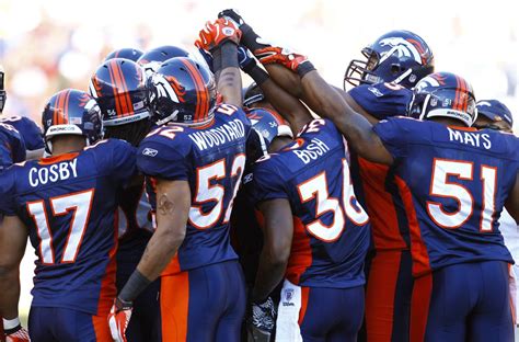 Defense get into a team huddle during an NFL game against the New ...