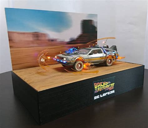 a toy car is on top of a wooden box with flames coming out of it