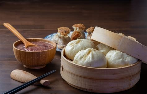 Premium Photo | Chinese breakfast. steamed buns and porridge are on the ...