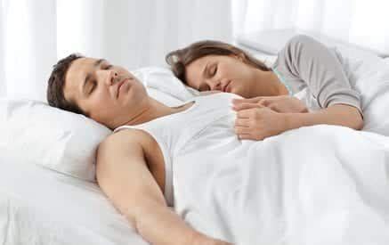 Cute couple sleeping together on their bed | 2 Brothers Mattress