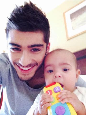 Baby love! Zayn Malik is 'da godfather' as fiancee Perrie Edwards says a 'bubby' is 'a long time ...