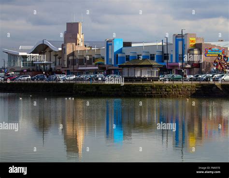 The seafront at New Brighton, Wallasey, UK with buildings reflected in ...