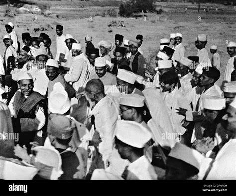 Mahatma Gandhi with his followers during the Salt March, 1930 (b/w ...