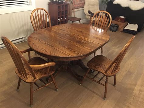 Solid oak dining table with 3 leaves, 2 captain chairs and 6 side ...