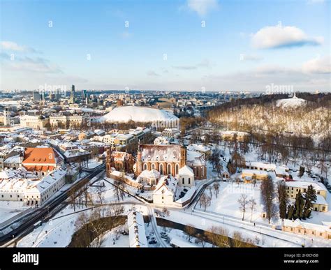 Beautiful Vilnius city panorama in winter with snow covered houses ...