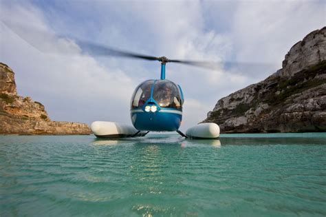 Robinson R44, Water landing in Mallorca www.sloanemallorca.com ...