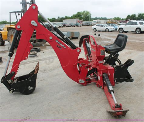 Mahindra 595 backhoe attachment in Norman, OK | Item H5815 sold | Purple Wave