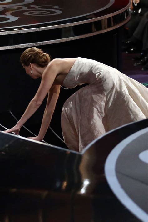 Jennifer Lawrence falls over as she collects Best Actress Oscar | Marie Claire UK