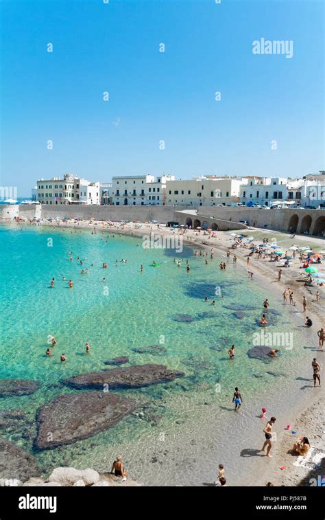 Public beach with italian people, Gallipoli, Lecce, Italy Stock Photo ...