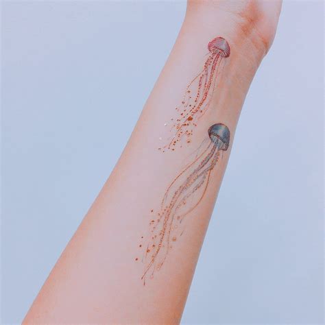 Related image | Jellyfish tattoo, Wrist tattoos for guys, Cool wrist tattoos