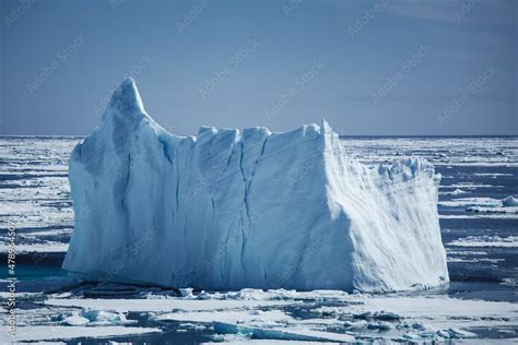 Icebergs floating in the melting sea ice in the Davis Strait. Stock ...