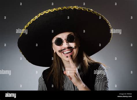 Person wearing sombrero hat in funny concept Stock Photo - Alamy