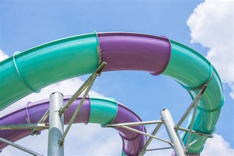 Premium Photo | Water slide with blue sky in water park